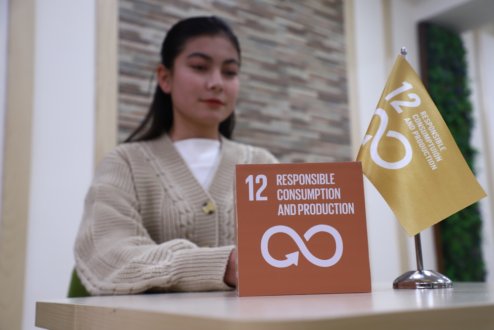 Female student on campus outdoors with a black top 