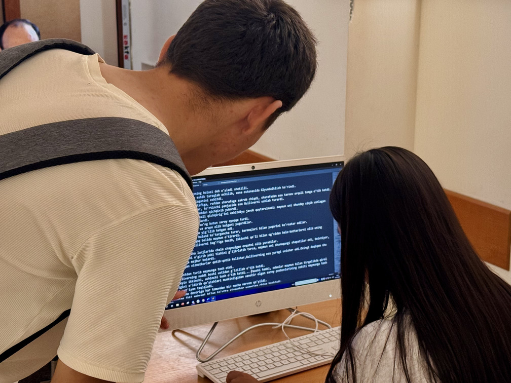 Female student on campus outdoors with a black top 